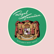 Load image into Gallery viewer, Green round luggage tag featuring Hawaii state seal and Royal Hawaiian, On The Beach At Waikiki Honolulu written on it, set against a light pink square background.