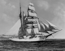 Load image into Gallery viewer, Black and white picture of an old ship with 12 sails on the ocean.