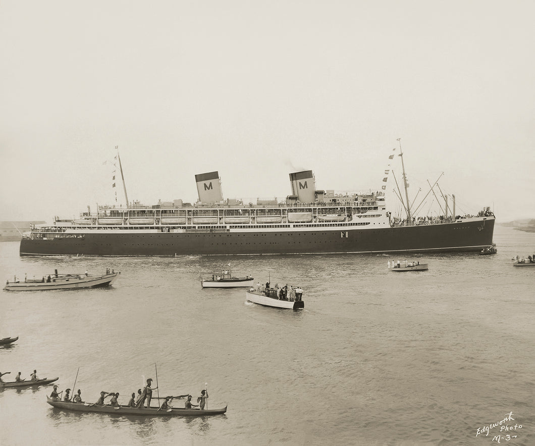 Photograph of a large cruise ship with two smokestacks. Several smaller boats and outrigger canoes float near the ship. Brown sepia tone. Signature on bottom right corner reads 'Edgeworth Photo M - 3'.