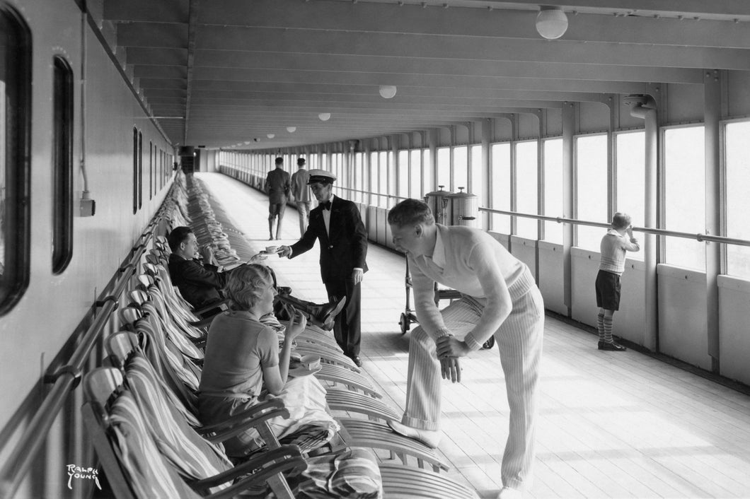 Black and white vintage photo of cruise ship passengers on lounge chairs during coffee and tea service.