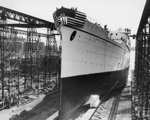 Load image into Gallery viewer, Black and white photograph of the bow of the Matson Line cruise ship LURLINE as it sits in dry dock.