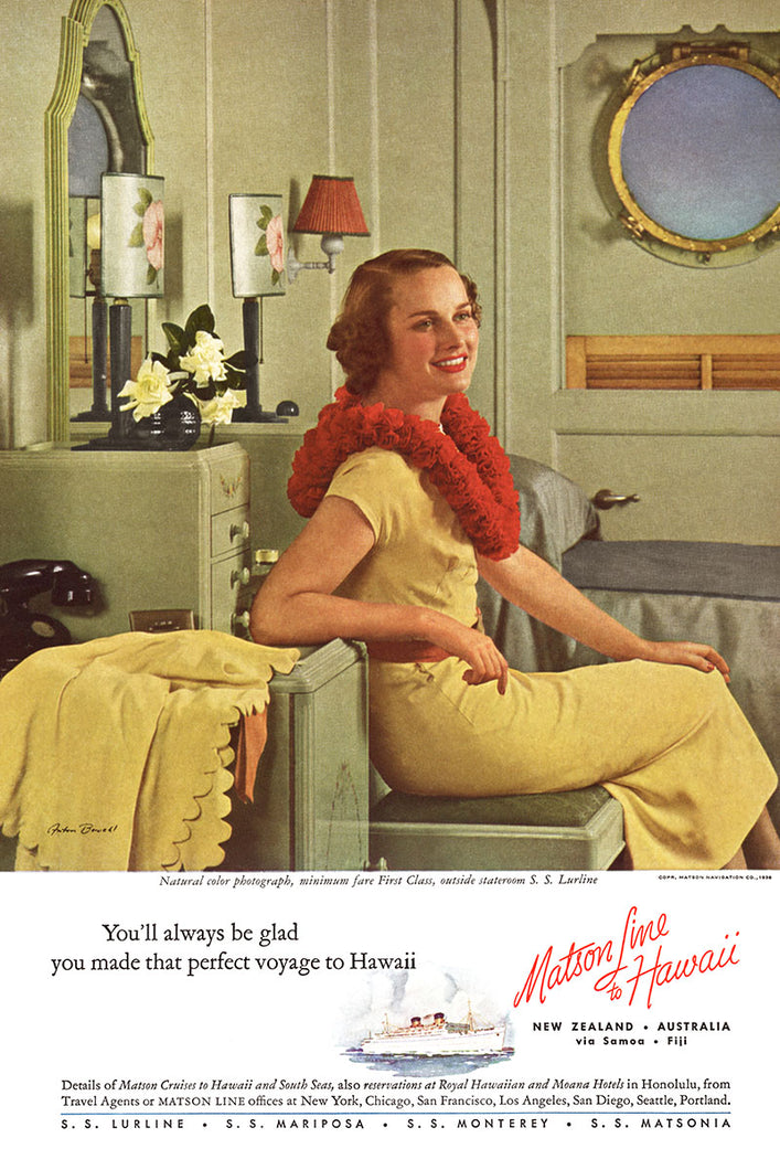 Photographer Anton Bruehl and Matson Line Hawaii travel advertisement featuring a woman in a yellow dress and red flower lei sitting on a green stool in front of a green vanity. A ship’s porthole over a bed in the background.